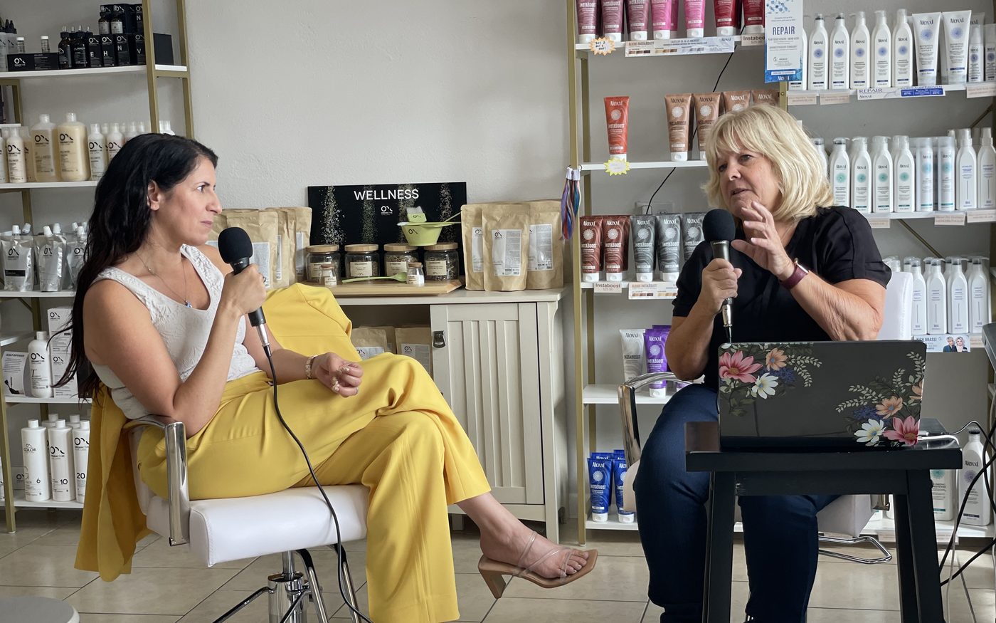 Jessica in conversation with a salon professional